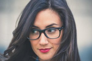 woman wearing horn-rimmed glasses