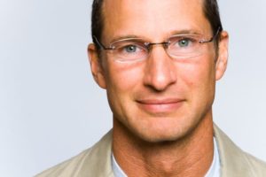 closeup of a man with glasses