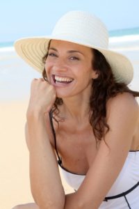 woman in sun dress and wide brimmed hat